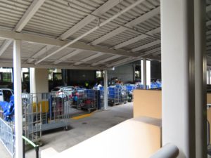 Bins at the cruise port, filled with luggage waiting to go on the cruise ship. Tips for first tipme cruisers.