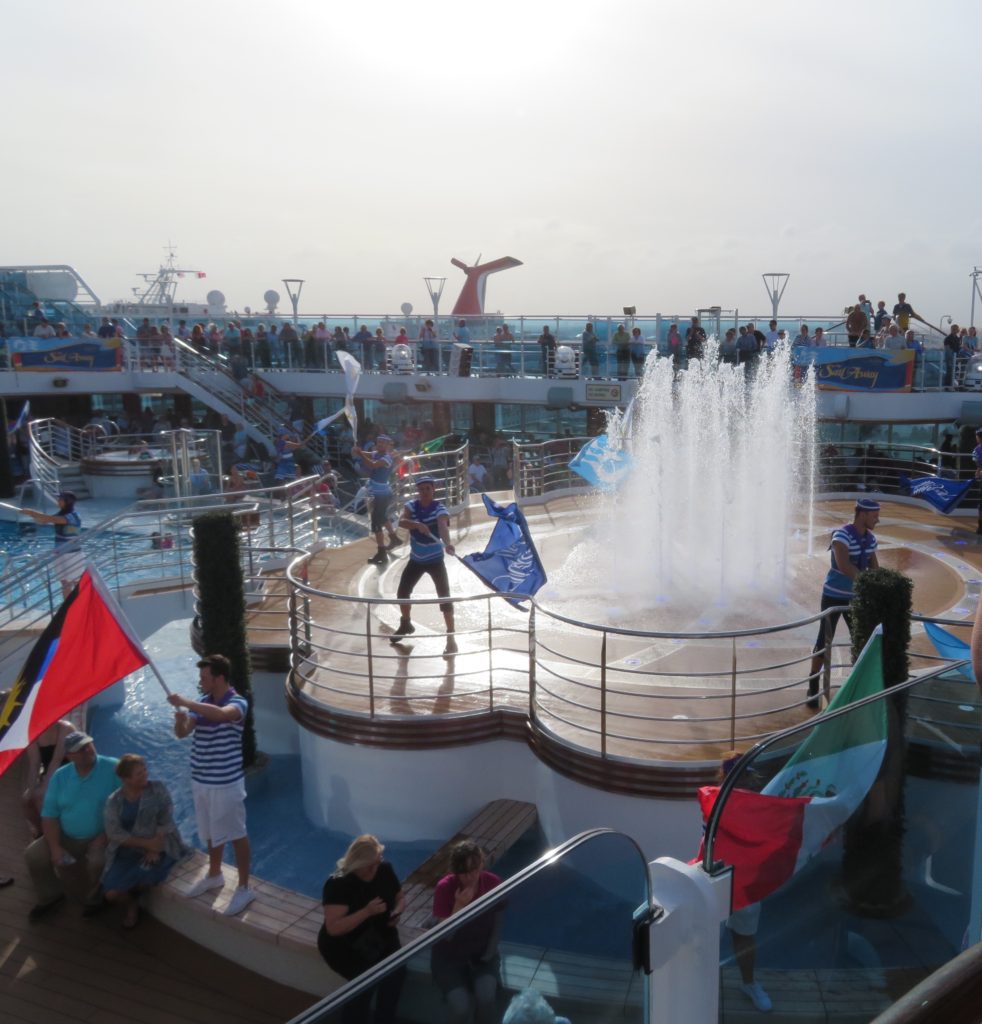 Sail away on the Royal Princess, outside. Staff are dancing, music is playing and all are ready for a great time!