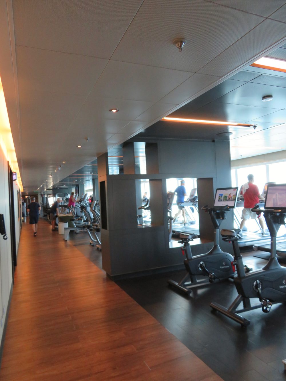 Interioe photo of cruise ship fitness center including stationary bikes, weights, tread mills |staying healthy on a cruise ship|