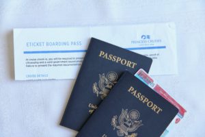 Important cruise travel documents, including 2 US passports, an Illinois state id and a boarding ticket from Princess Cruises, showing 1 of 9 ways to ruin your cruise