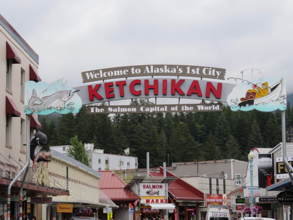 Iconic sign Welcome to Ketchikan that hangs over the main street in town. One day in port Ketchikan