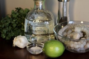 Ingredients for Tequila Lime Shrimp including Patron tequila, fresh lime, garlic, shrimp and salt
